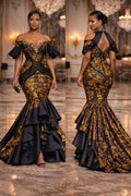 Woman wearing a black and gold dress in an elegant interior setting